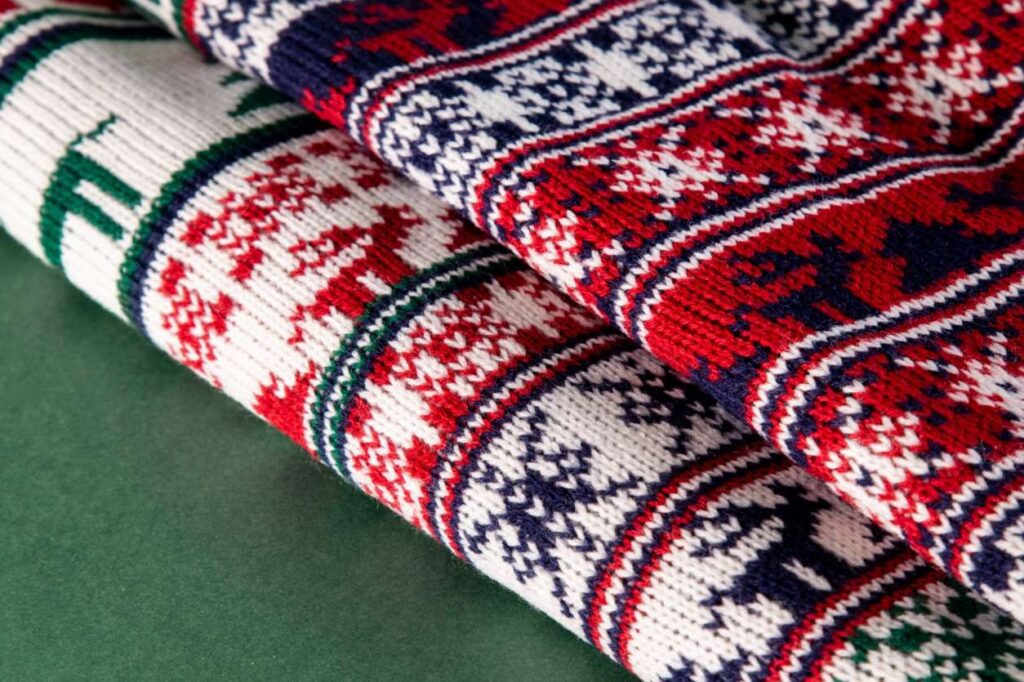 christmas-sweaters-arrangement-high-angle-scaled (1) (1)